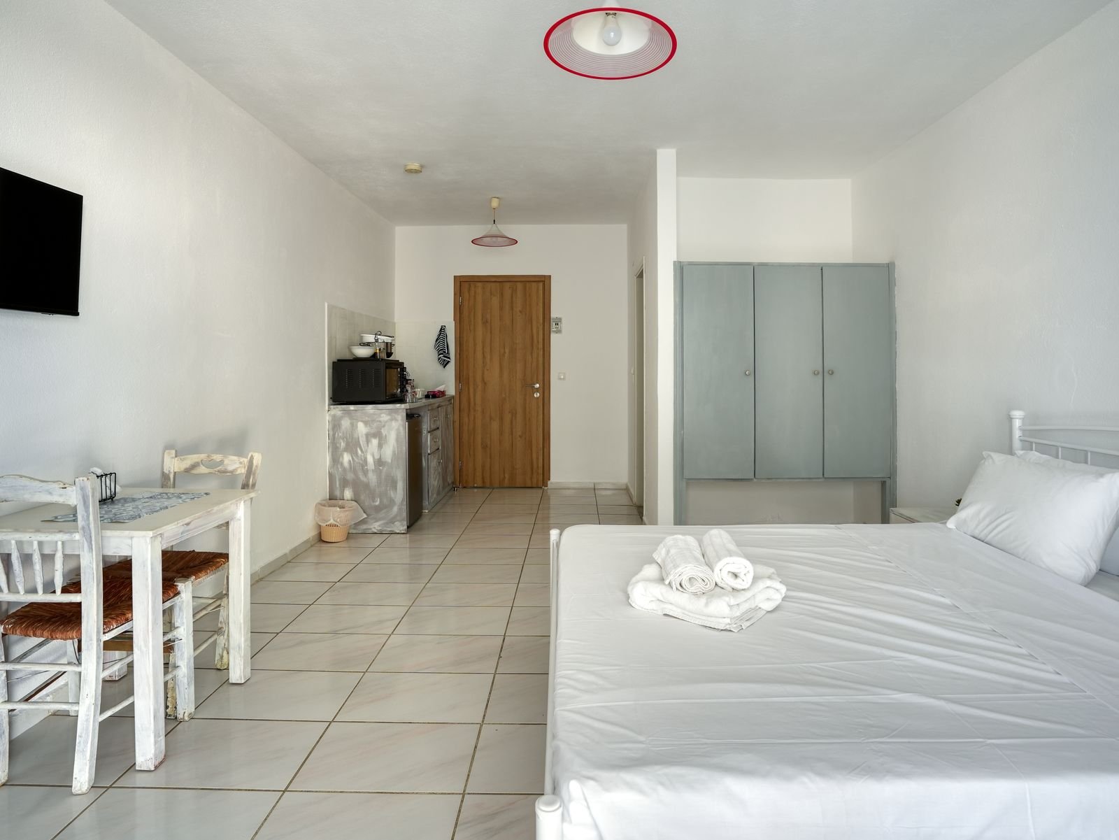 Studio interior with dining corner and wardrobe
