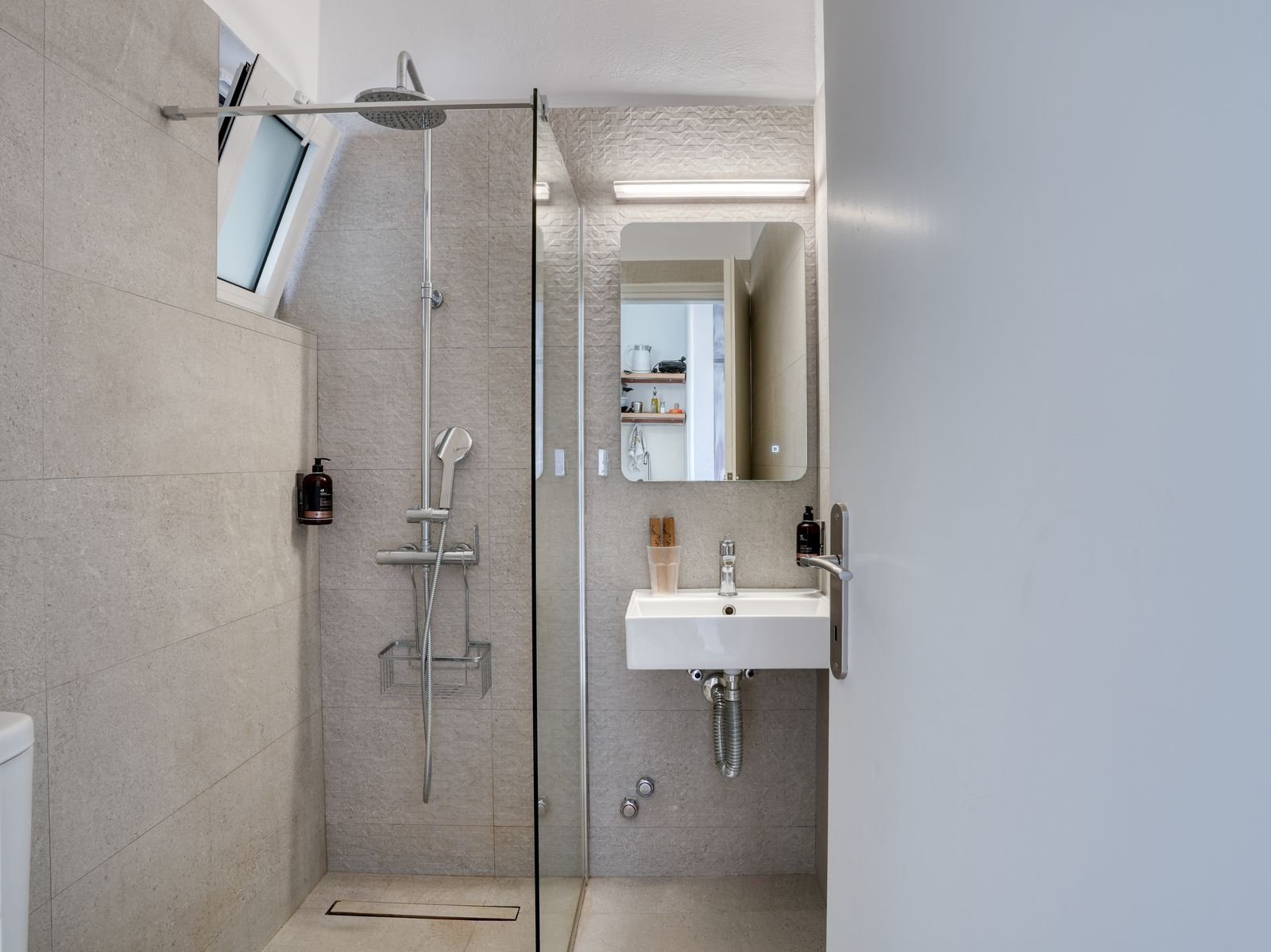 Renovated bathroom with rain shower